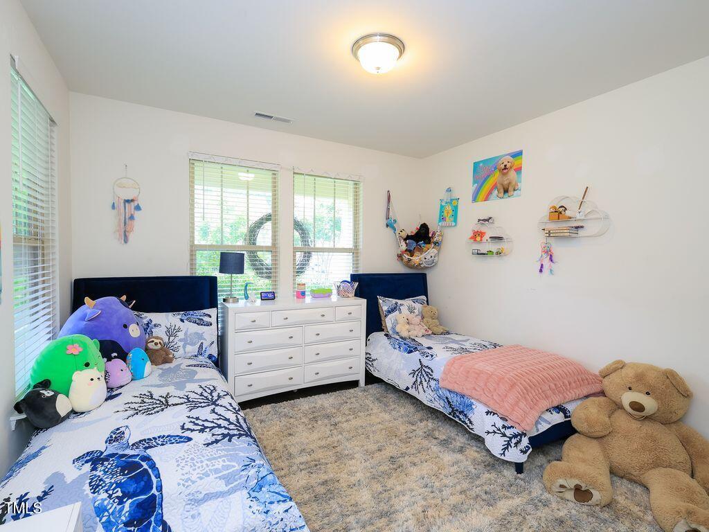 110 Point View Way Franklinton, NC 27525 - Photo 38 of 62 a bedroom with a bed and a dresser