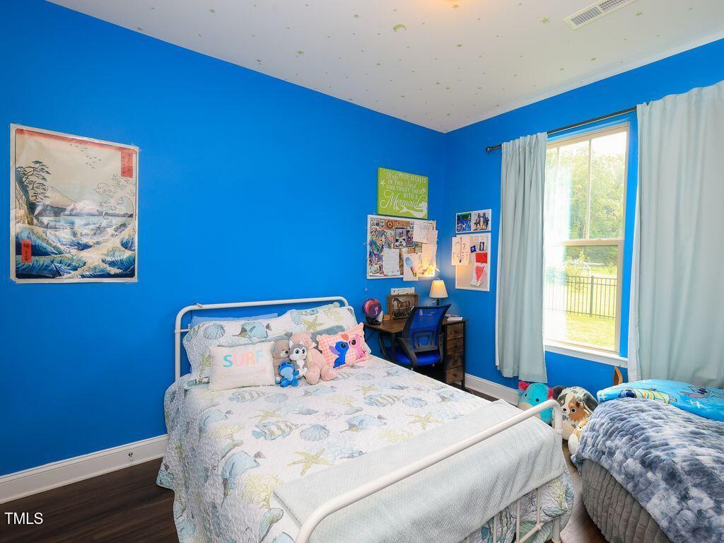 110 Point View Way Franklinton, NC 27525 - Photo 46 of 62 a bedroom with a bed and a window