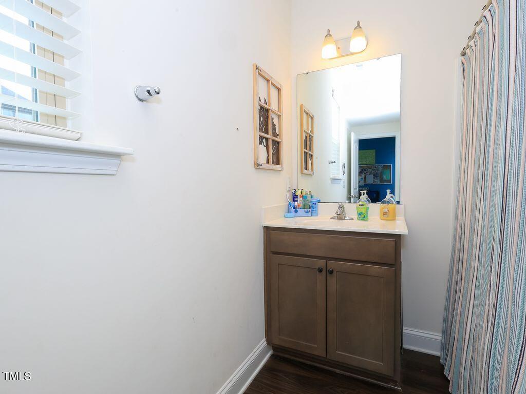 110 Point View Way Franklinton, NC 27525 - Photo 48 of 62 a bathroom with a sink and a mirror
