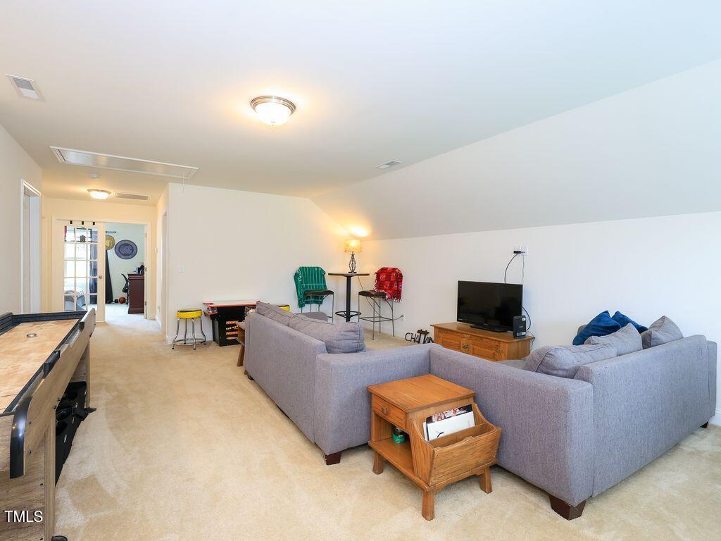 110 Point View Way Franklinton, NC 27525 - Photo 50 of 62 a living room with furniture and a flat screen tv