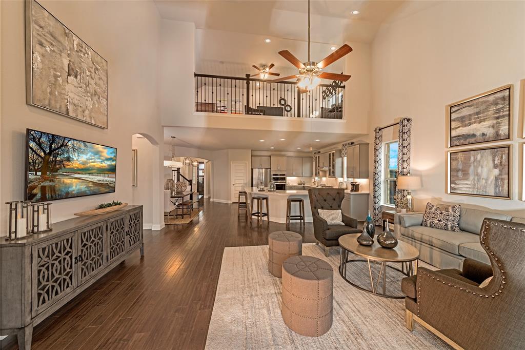 112 Capital Court Forney, TX 75126 - Photo 5 of 13 a living room with furniture and a flat screen tv