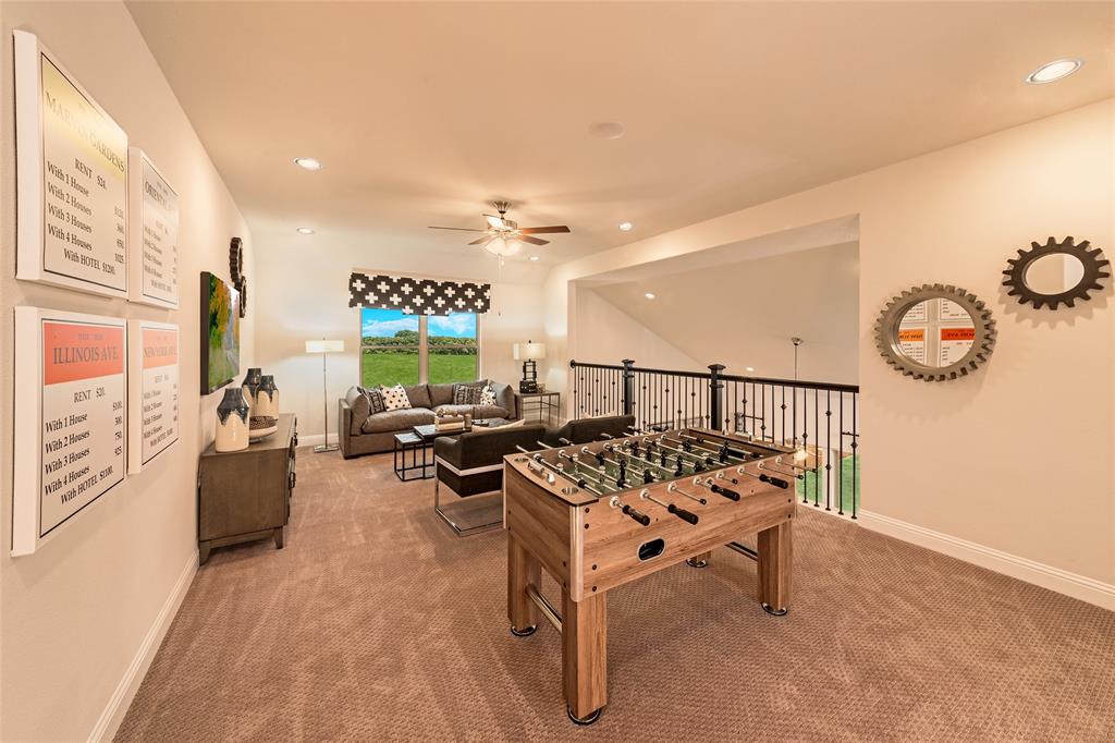 112 Capital Court Forney, TX 75126 - Photo 10 of 13 a living room with furniture a rug and a window