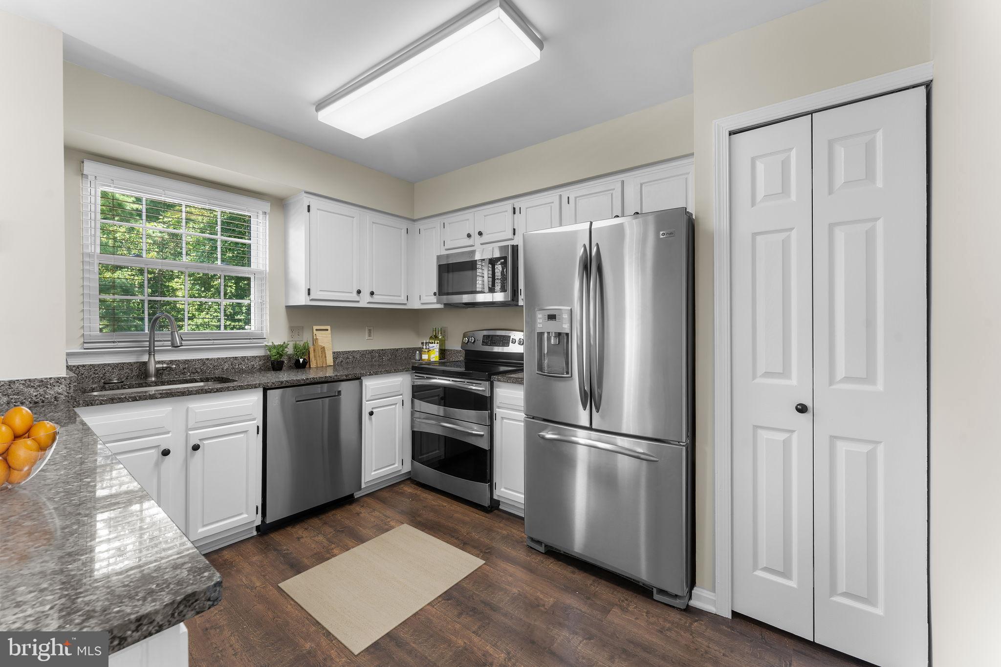 5128 Spring Branch Boulevard Dumfries, VA 22025 - Photo 11 of 60 Freshly finished cabinets (virtually staged)