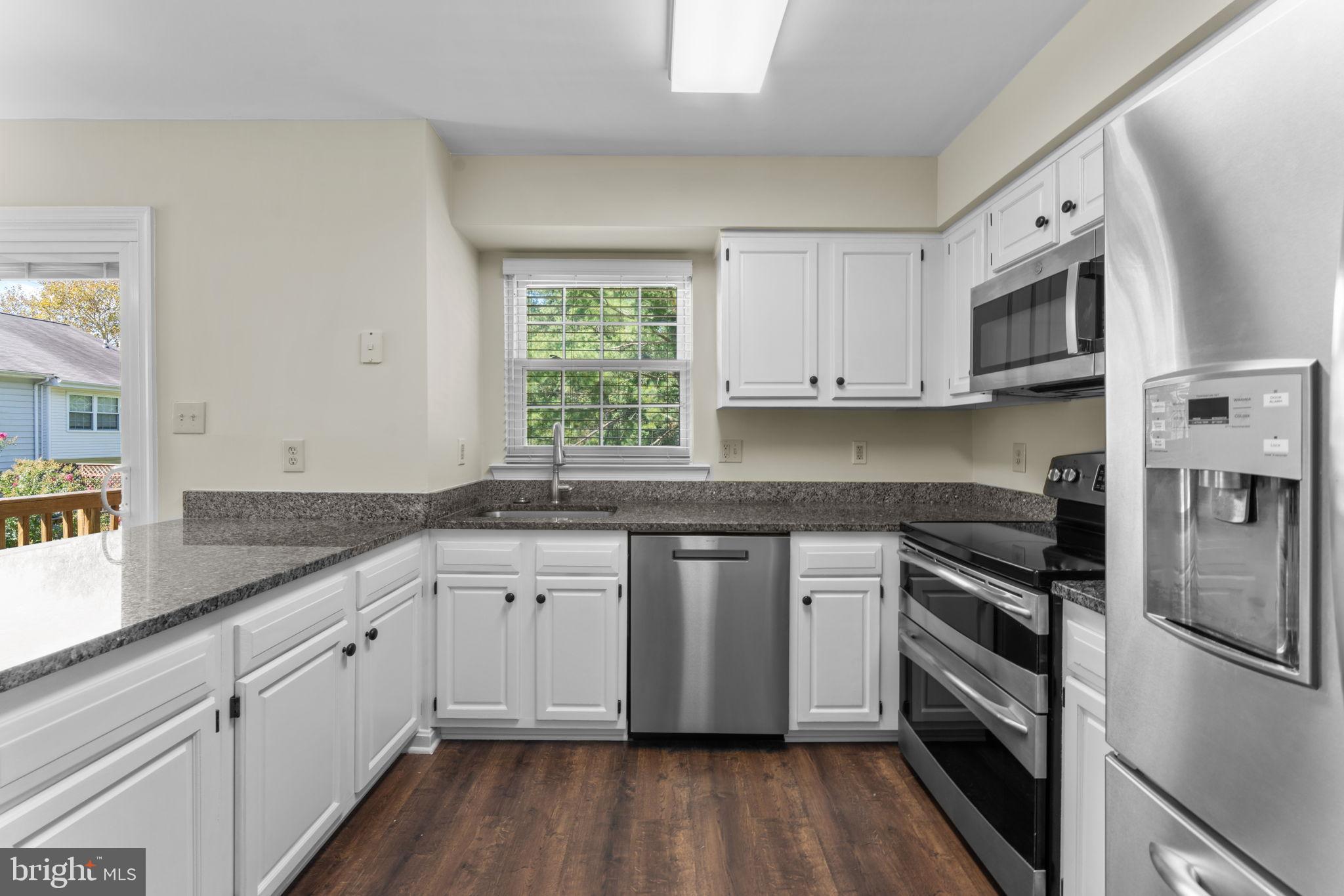 5128 Spring Branch Boulevard Dumfries, VA 22025 - Photo 15 of 60 Finished cabinets, granite counters, dual stove.