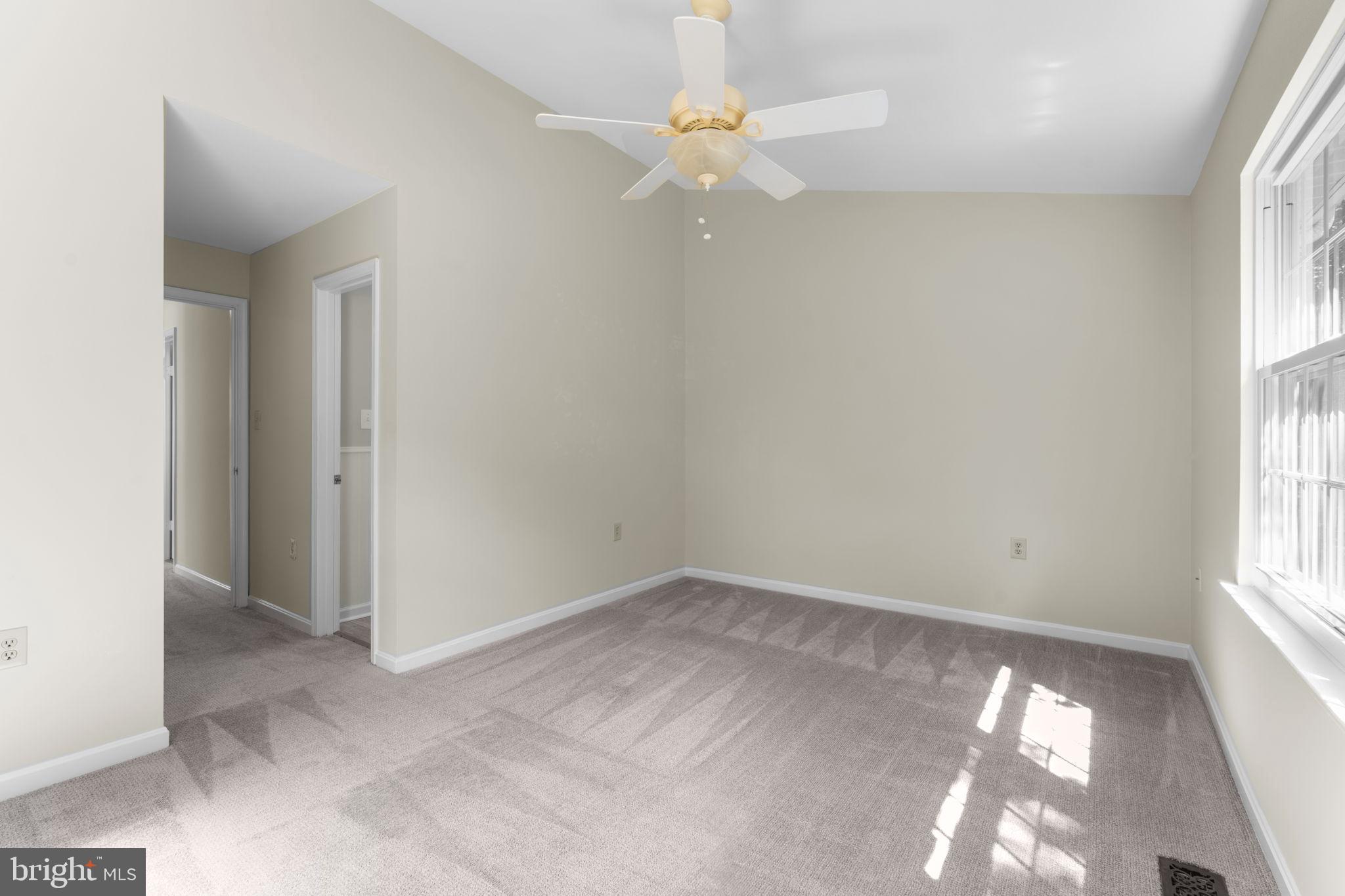 5128 Spring Branch Boulevard Dumfries, VA 22025 - Photo 25 of 60 Primary bedroom w/en-suite and vaulted ceilings.