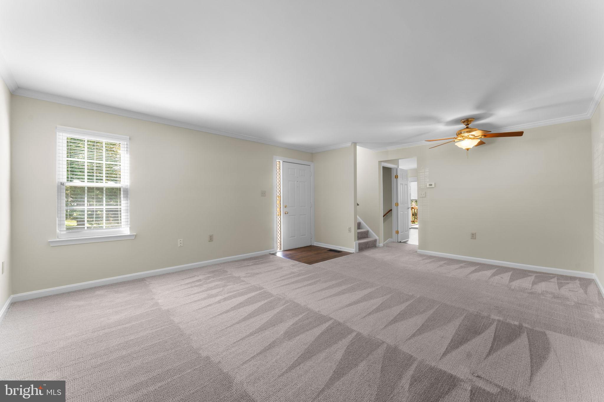 5128 Spring Branch Boulevard Dumfries, VA 22025 - Photo 7 of 60 Living area leads to upstairs and kitchen.