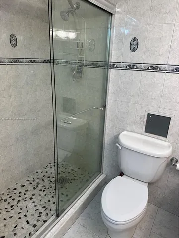 a view of a hallway with a chandelier