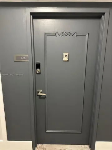 a view of walk in closet with clothes