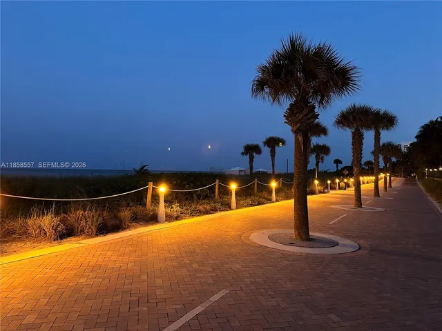 a view of a backyard with table and chairs