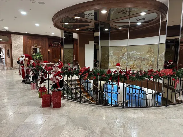 a living room with lots of furniture and a chandelier