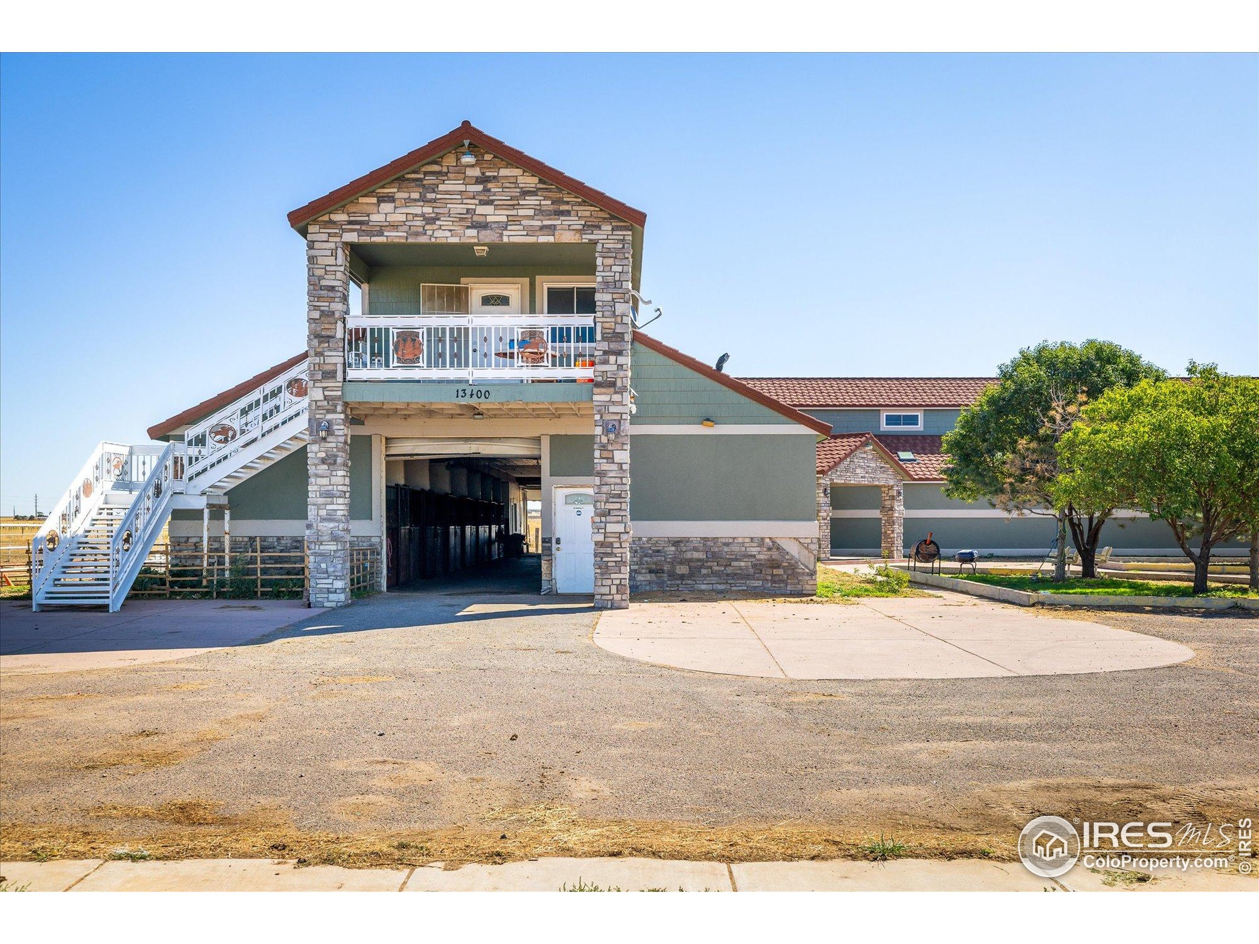 13400 Harvest Road Commerce City, CO 80022 - Photo 12 of 50 a view of an house with backyard and trees