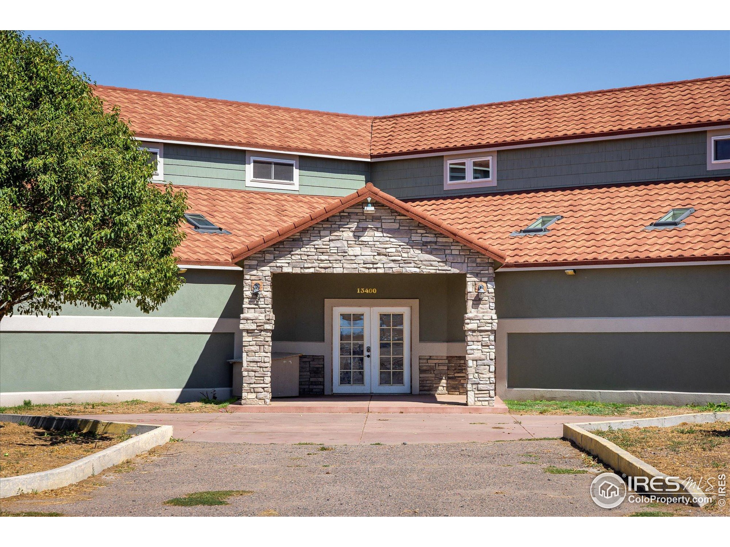 13400 Harvest Road Commerce City, CO 80022 - Photo 13 of 50 a front view of a house with a yard
