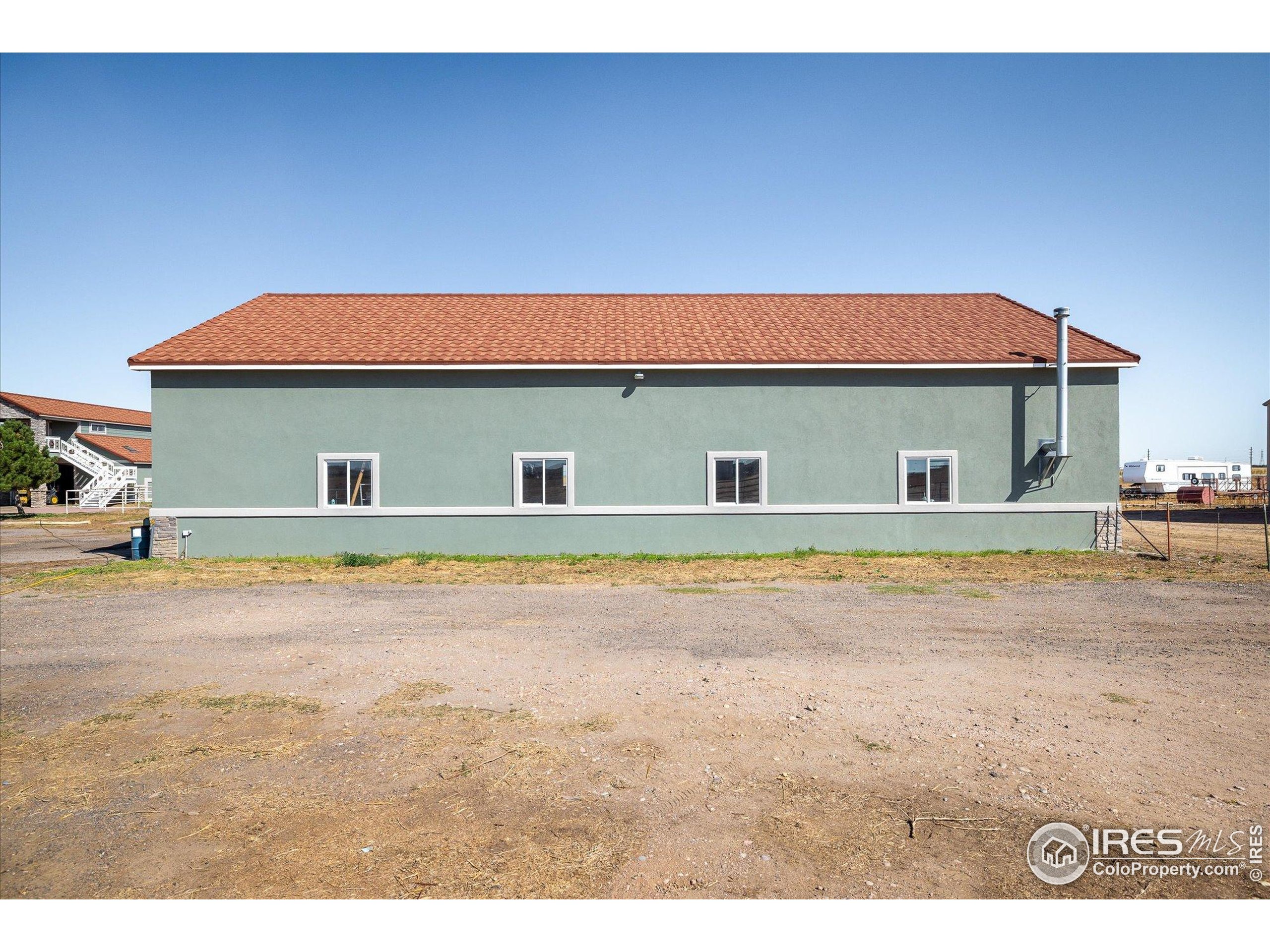 13400 Harvest Road Commerce City, CO 80022 - Photo 24 of 50 a house with swimming pool in front of it