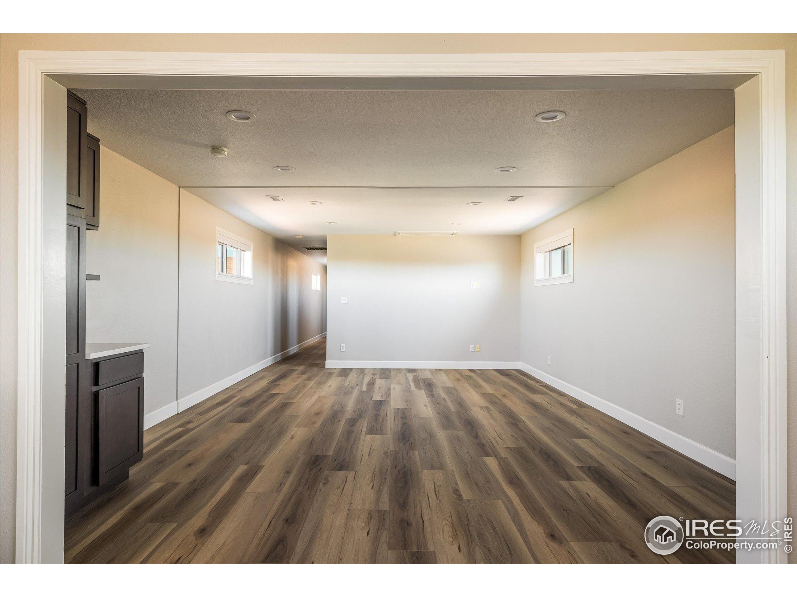 13400 Harvest Road Commerce City, CO 80022 - Photo 30 of 50 a view of an empty room and wooden floor