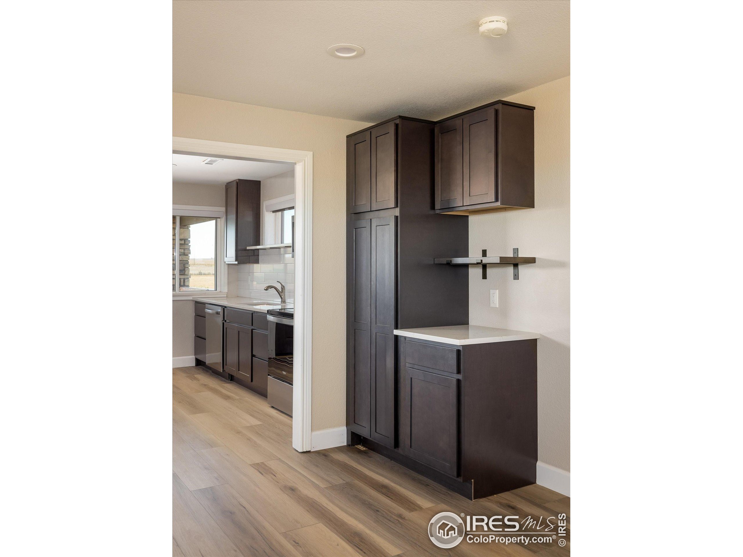13400 Harvest Road Commerce City, CO 80022 - Photo 33 of 50 a kitchen with stainless steel appliances a sink and cabinets
