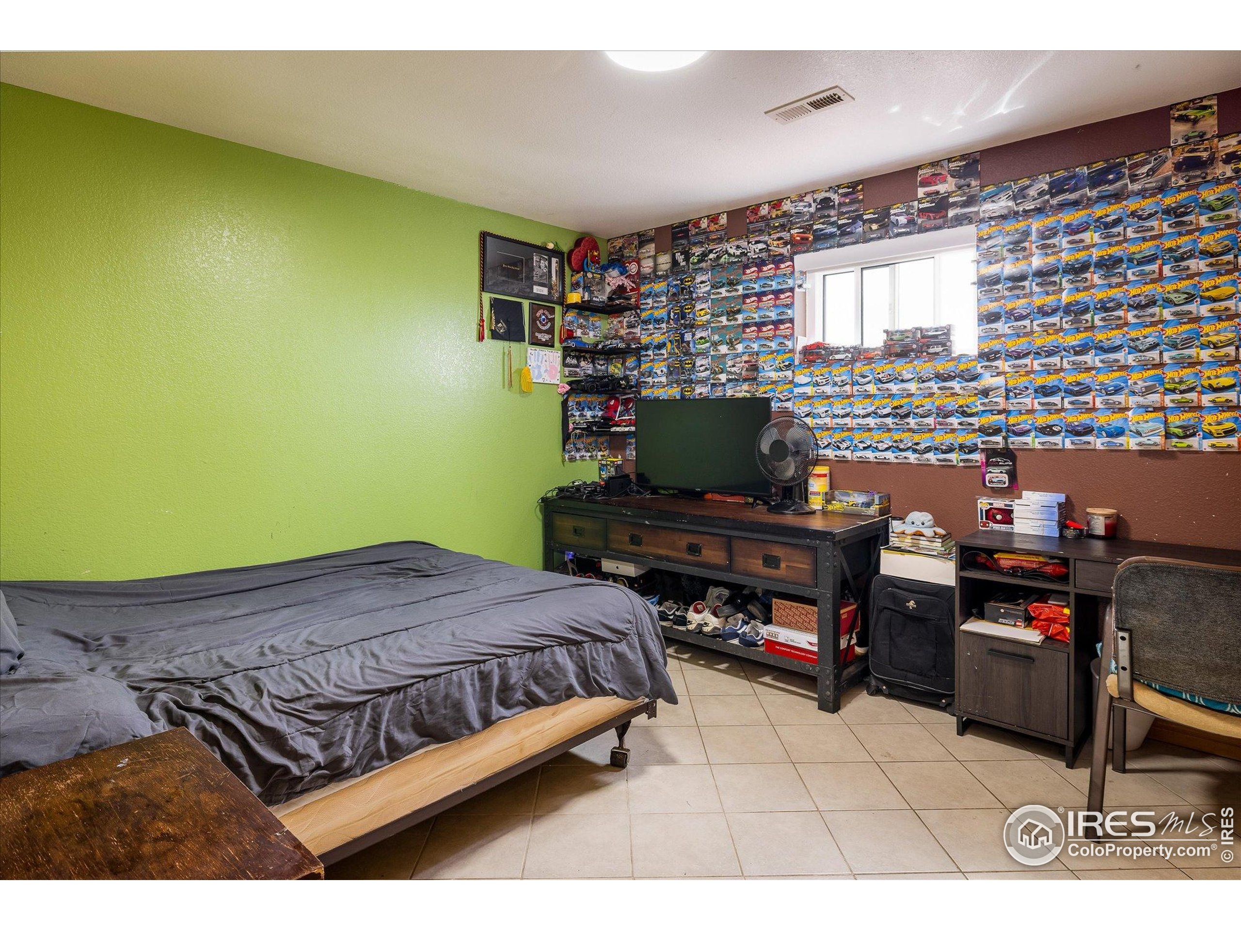 13400 Harvest Road Commerce City, CO 80022 - Photo 48 of 50 a bedroom with a bed and a desk