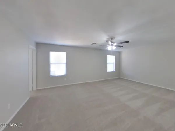a large kitchen with cabinets a sink stainless steel appliances and cabinets