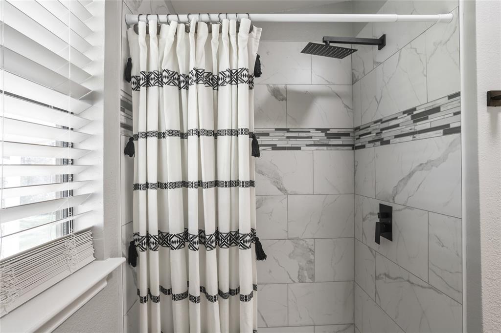 938 Amsden Street Denison, TX 75020 - Photo 31 of 40 This new shower was a great addition to this bathroom.