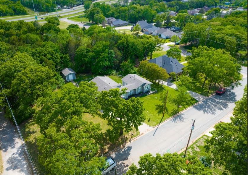 938 Amsden Street Denison, TX 75020 - Photo 36 of 40 Located on a corner lot and surrounded by trees on three sides, this home tucked into this neighborhood that is adjacent to a newer home and a newer neighborhood across the street.