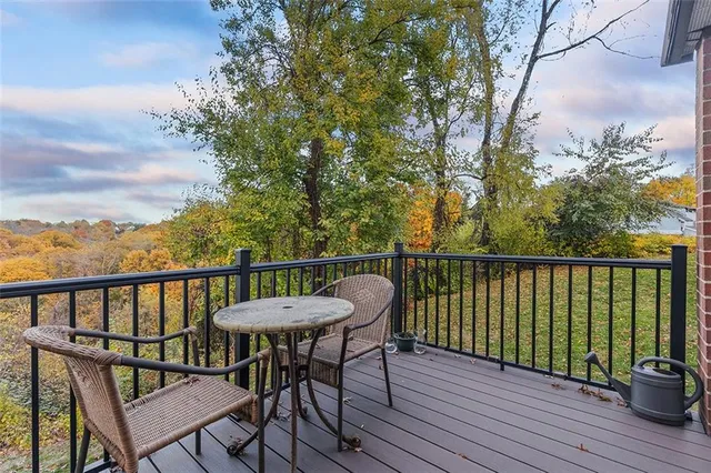 a view of a balcony with furniture