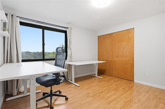 a view of a room with a table and chairs