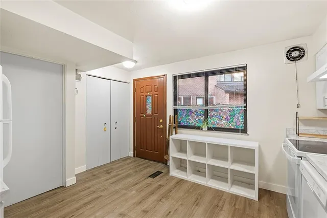 a view of wooden floor and windows in a room