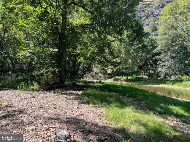 a view of a room with gym equipment and windows