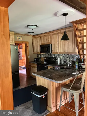 a bathroom with a toilet and a mirror