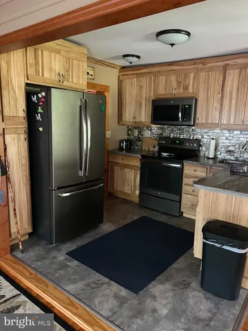 a bathroom with a shower curtain and a window