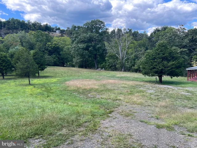 a view of outdoor space with deck and yard