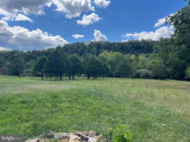 a view of outdoor space with deck and yard