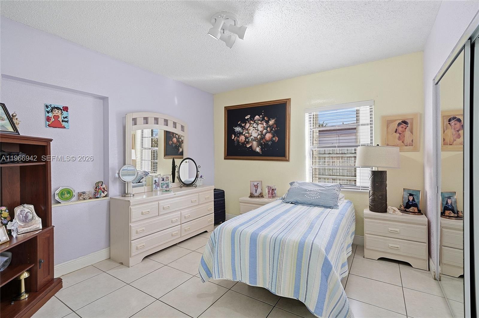 4791 West 3rd Avenue Hialeah, FL 33012 - Photo 11 of 30 a bedroom with a bed and a desk