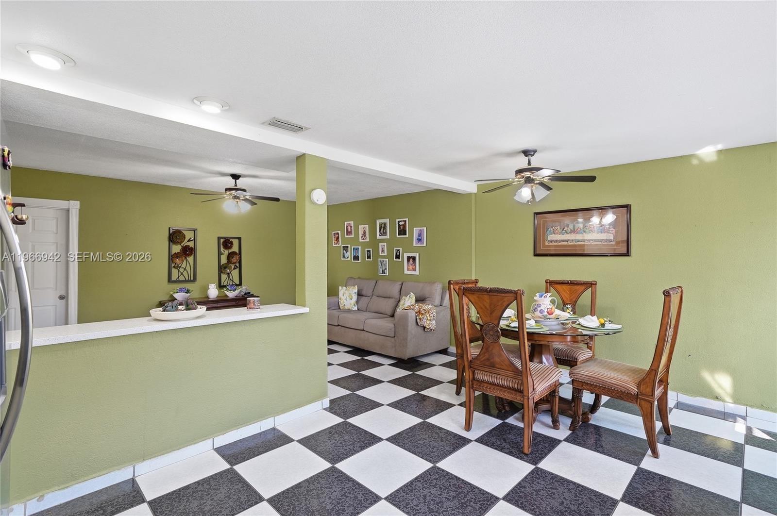 4791 West 3rd Avenue Hialeah, FL 33012 - Photo 20 of 30 a dining room with furniture and wooden floor