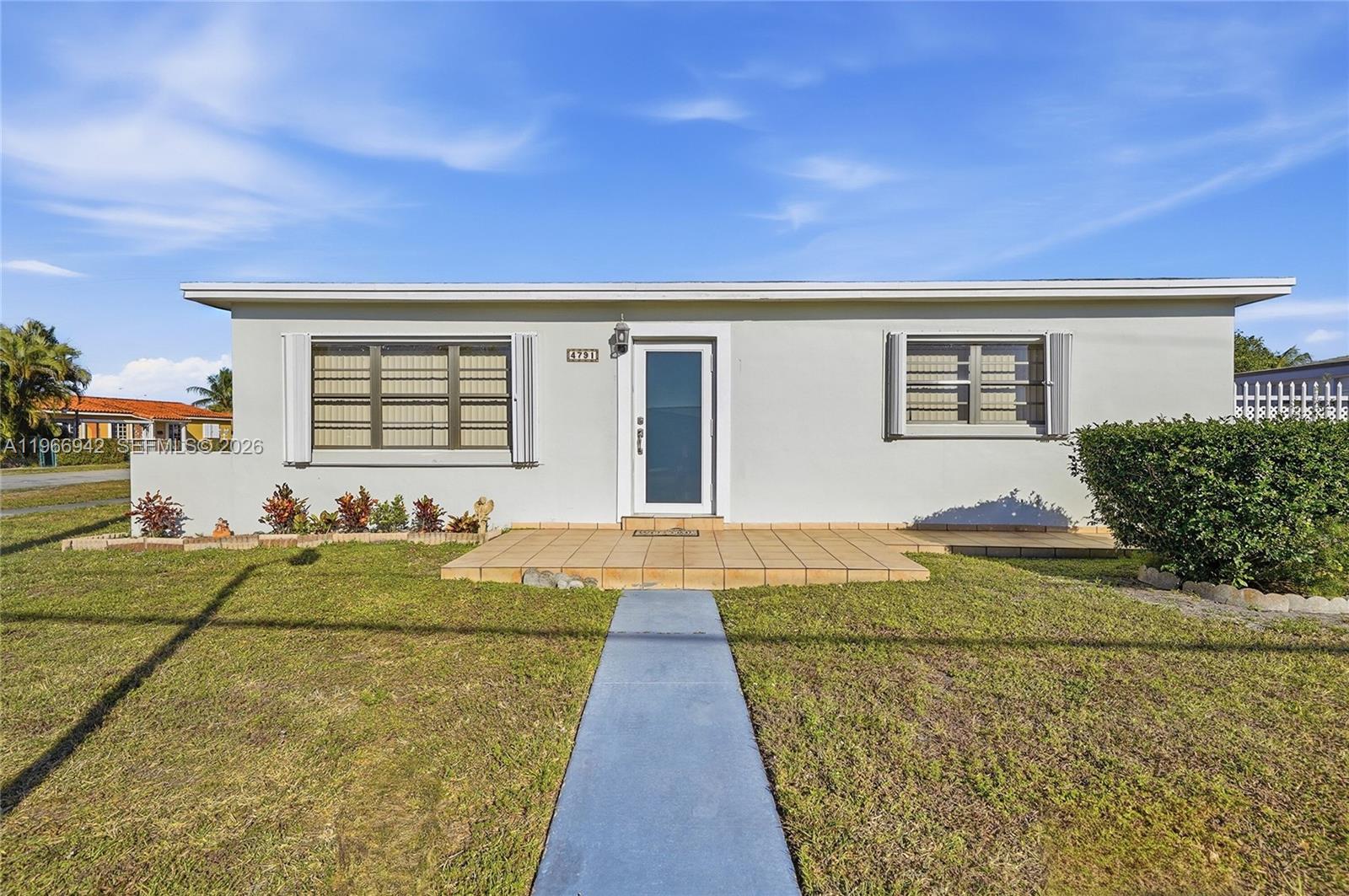 4791 West 3rd Avenue Hialeah, FL 33012 - Photo 2 of 30 a front view of house with yard