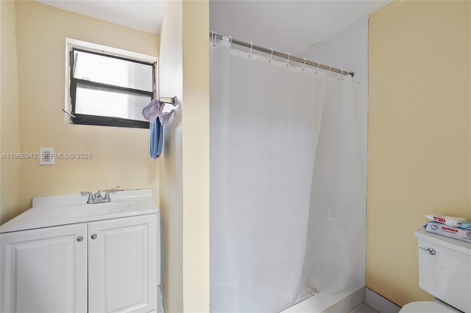 4791 West 3rd Avenue Hialeah, FL 33012 - Photo 26 of 30 a bathroom with a sink a toilet and shower