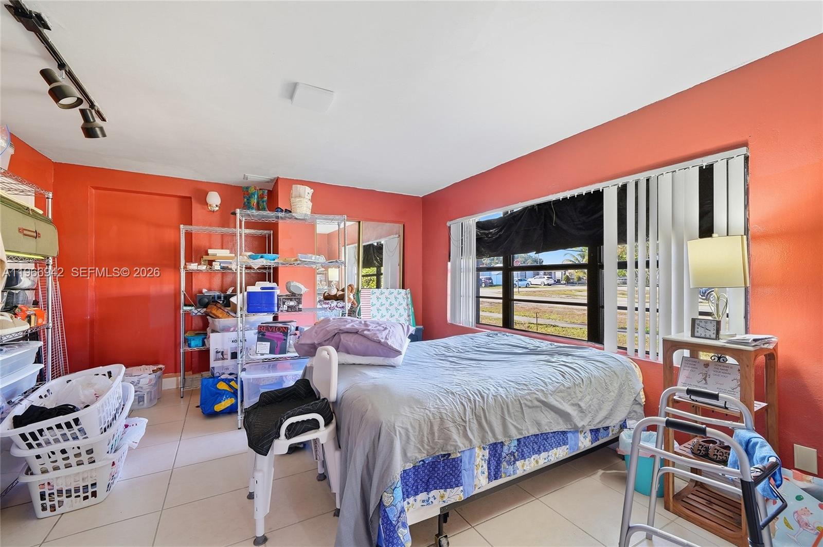 4791 West 3rd Avenue Hialeah, FL 33012 - Photo 27 of 30 a bed room with a bed and a chair