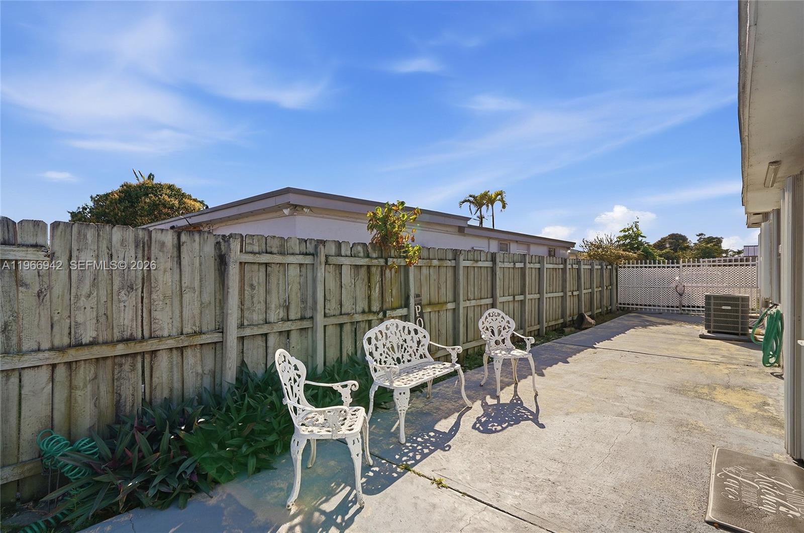 4791 West 3rd Avenue Hialeah, FL 33012 - Photo 30 of 30 a view of a chairs and table in backyard