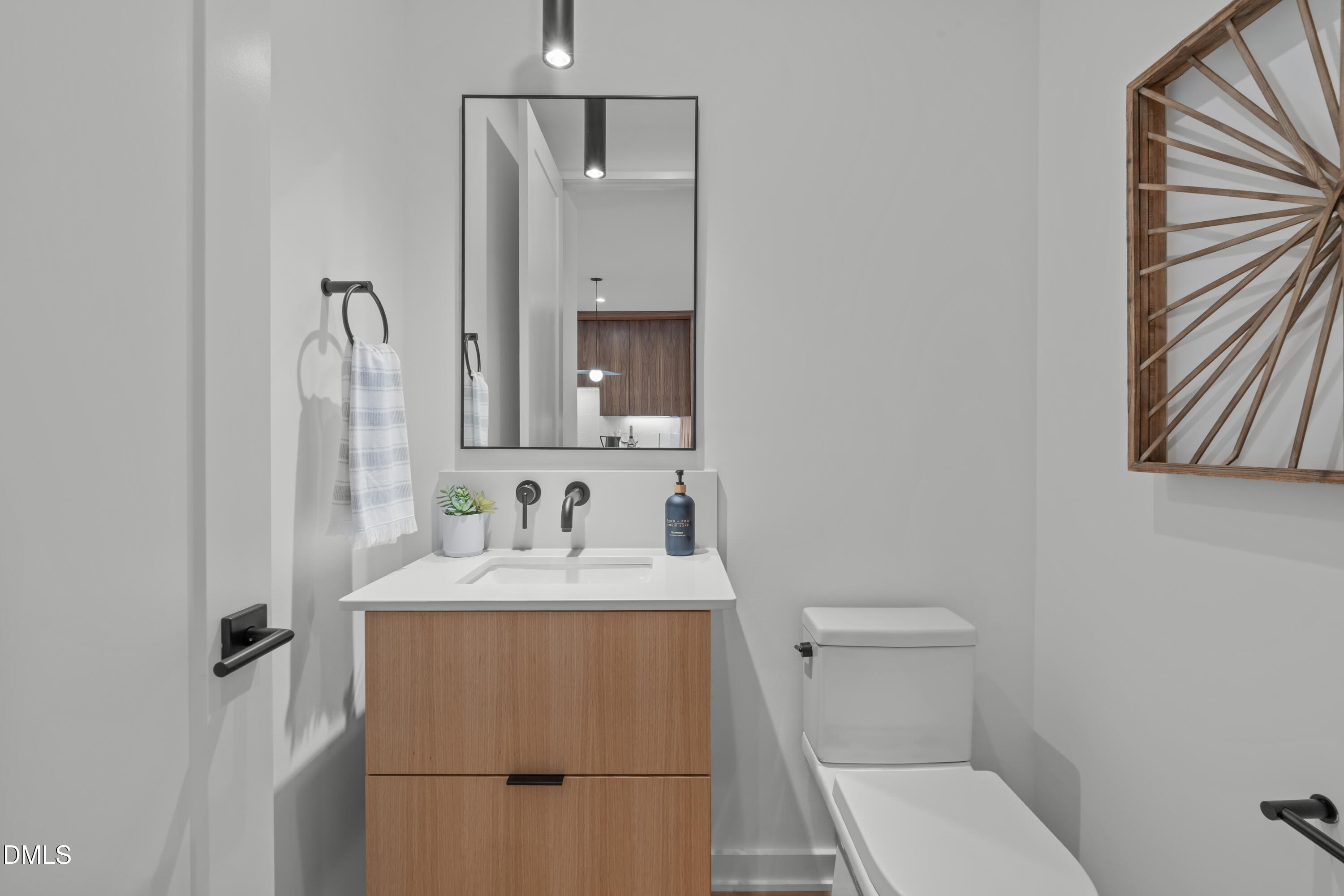 1307 Chamblee Hl Court Raleigh, NC 27608 - Photo 22 of 65 a bathroom with a sink toilet and mirror