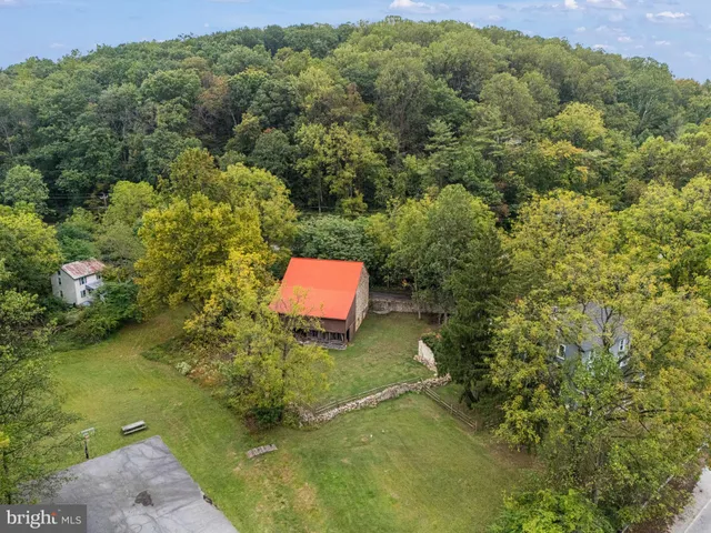 a aerial view of a house with a yard