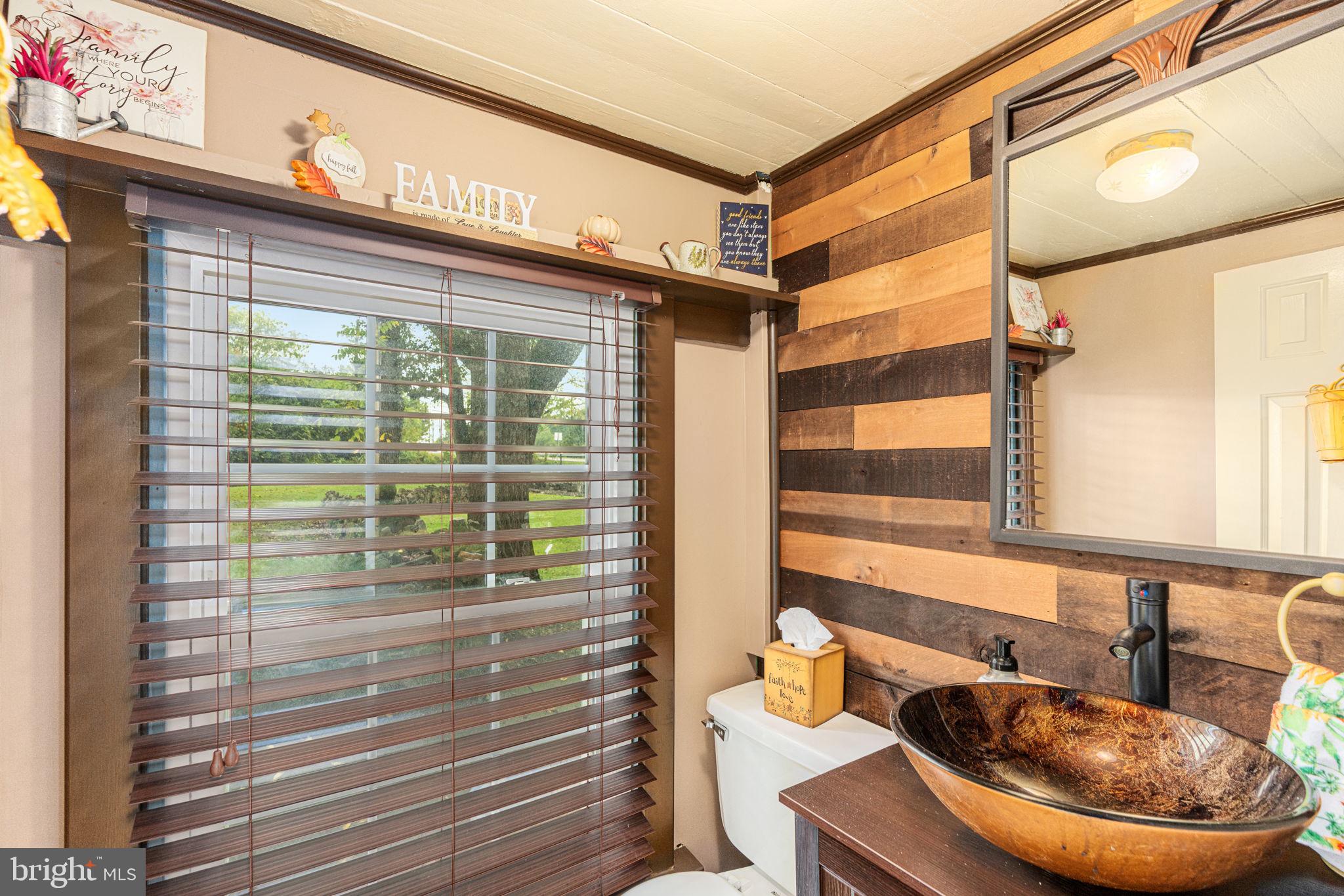 4701 Edges Mill Road Downingtown, PA 19335 - Photo 15 of 56 a bathroom with a sink and a mirror