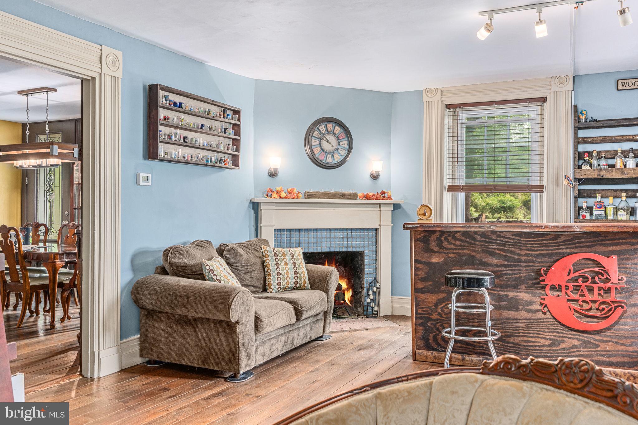 4701 Edges Mill Road Downingtown, PA 19335 - Photo 18 of 56 a living room with furniture and a fireplace