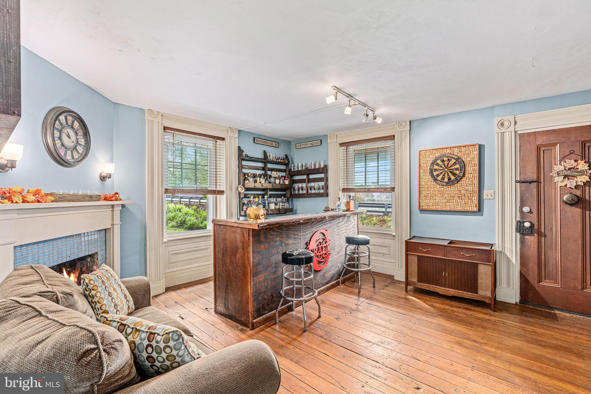 4701 Edges Mill Road Downingtown, PA 19335 - Photo 20 of 56 a living room with furniture and a fireplace