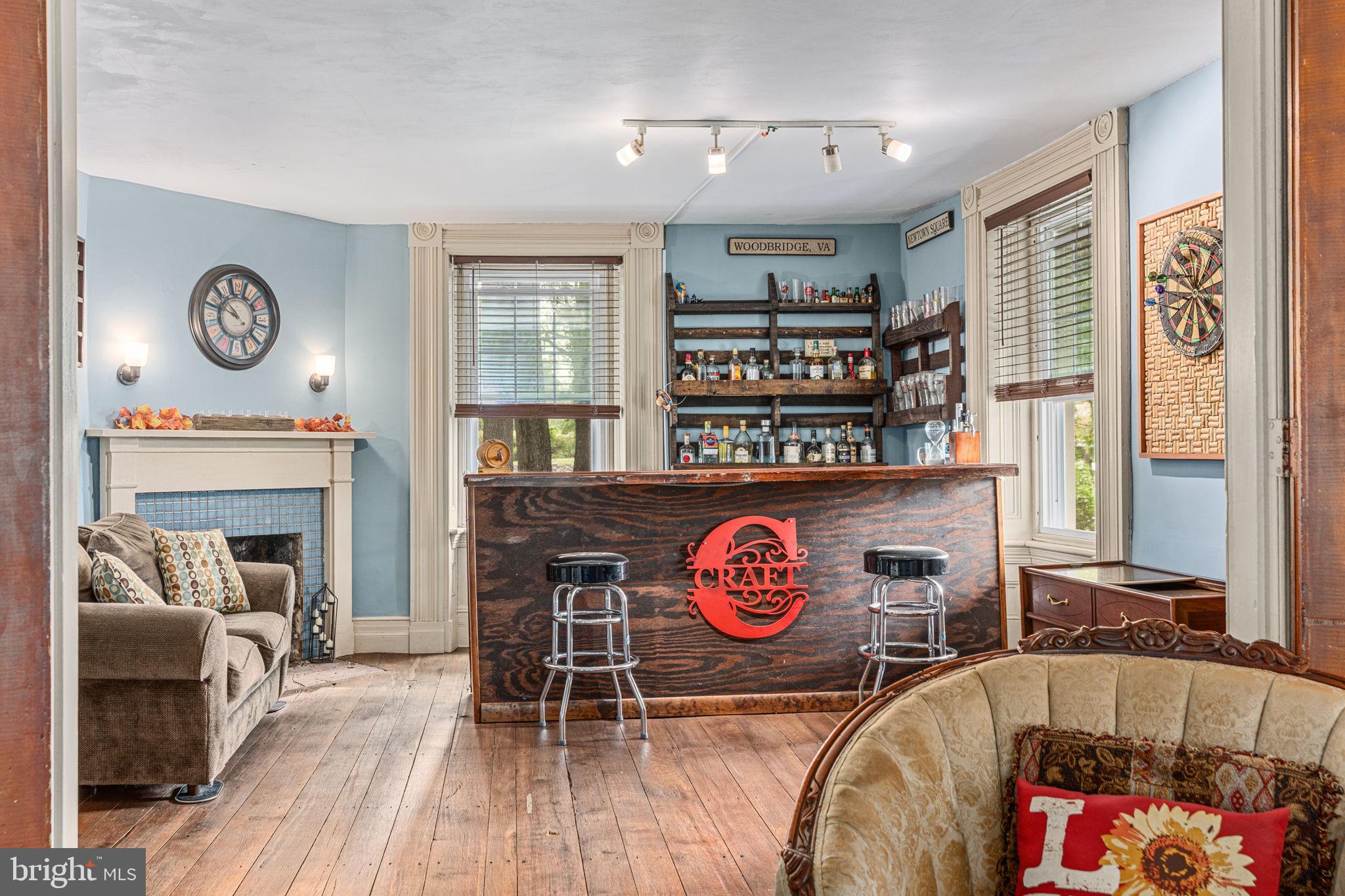 4701 Edges Mill Road Downingtown, PA 19335 - Photo 23 of 56 a view of a livingroom with furniture and a fireplace