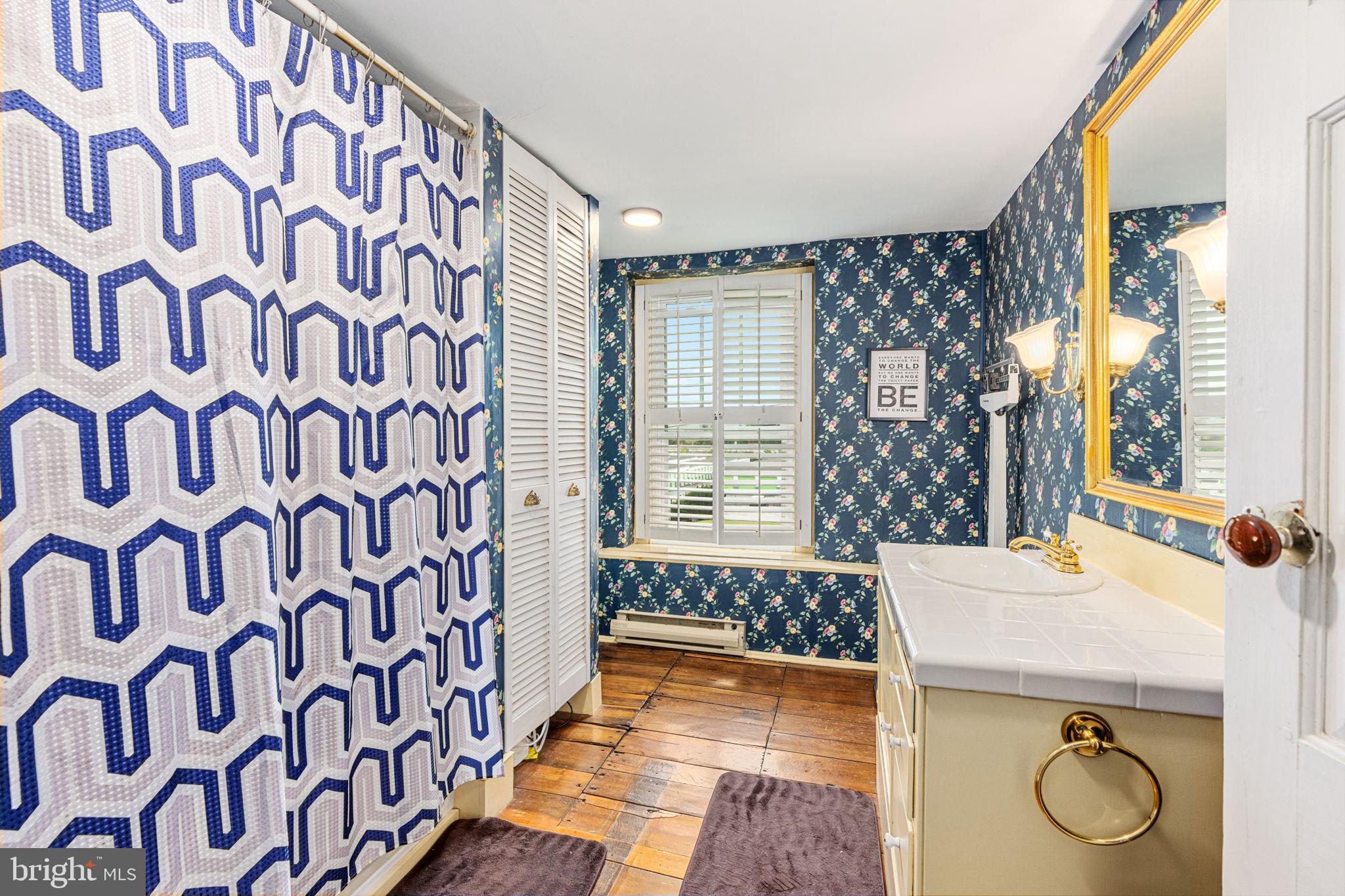 4701 Edges Mill Road Downingtown, PA 19335 - Photo 38 of 56 a bathroom with a sink and a mirror