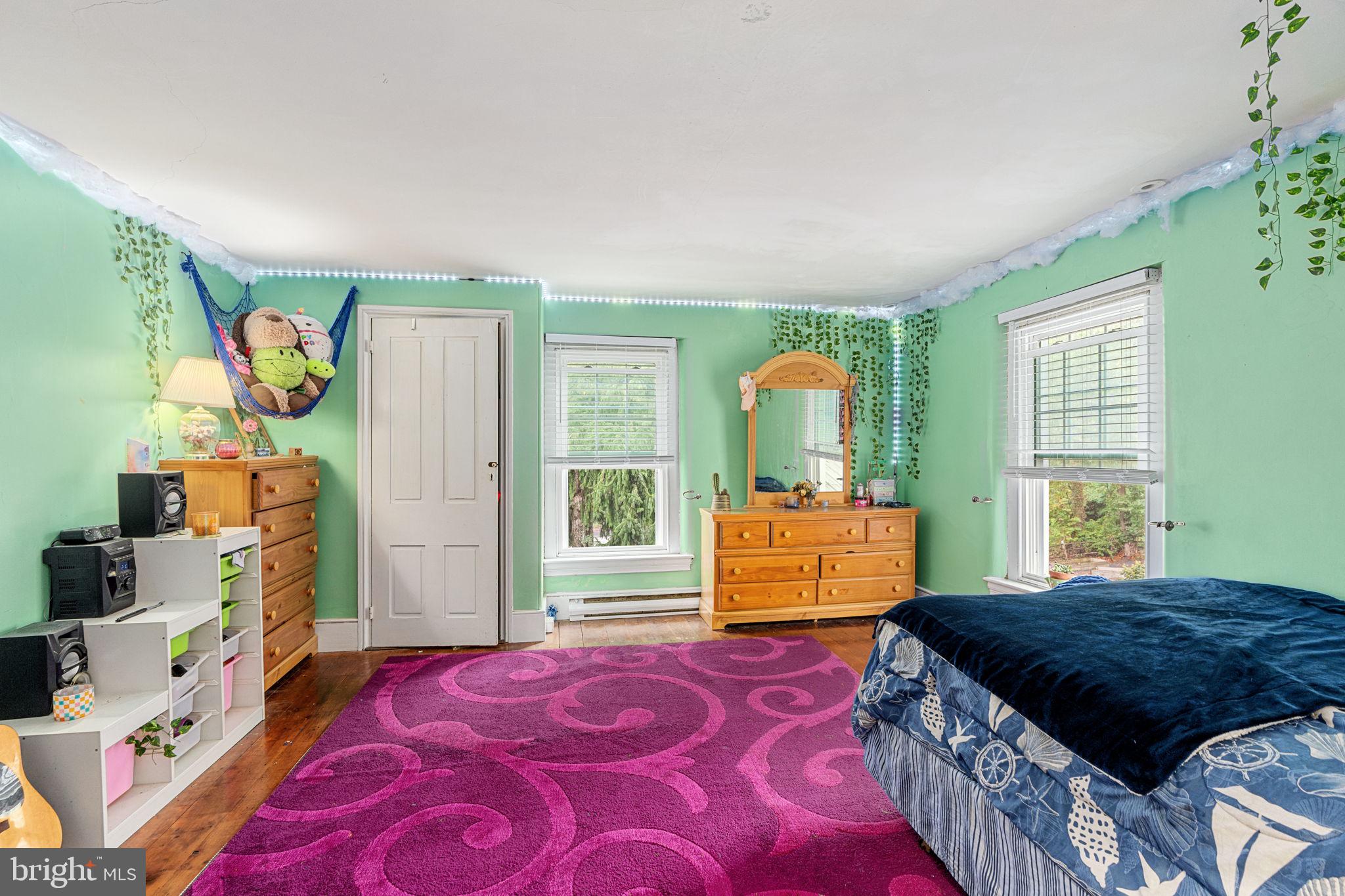 4701 Edges Mill Road Downingtown, PA 19335 - Photo 40 of 56 a bedroom with a bed and wooden floor