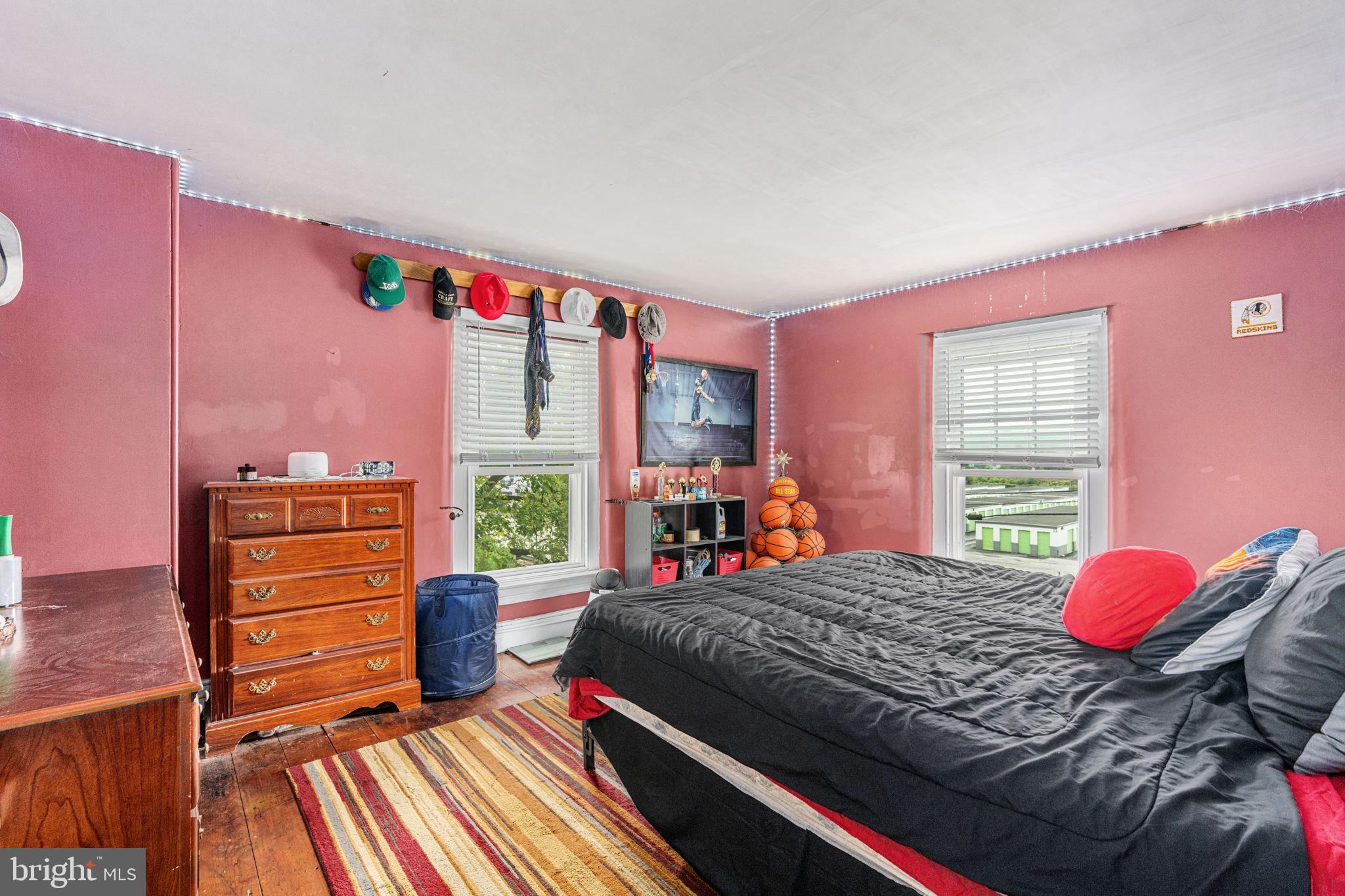 4701 Edges Mill Road Downingtown, PA 19335 - Photo 41 of 56 a bedroom with a bed and wooden floor