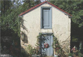 4701 Edges Mill Road Downingtown, PA 19335 - Photo 49 of 56 a front view of a house with a yard