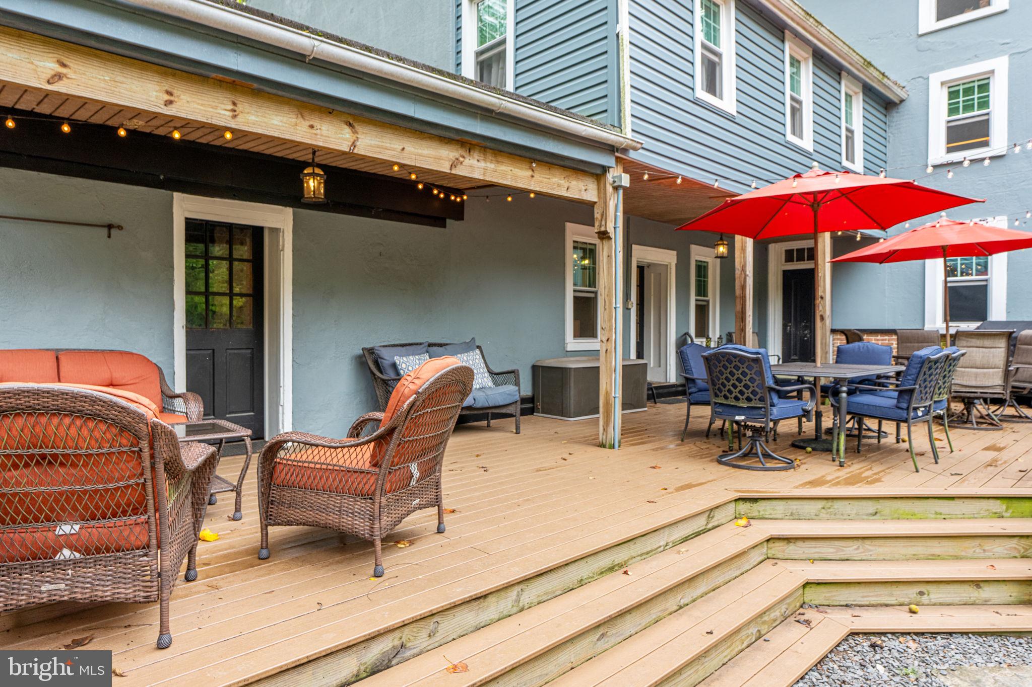 4701 Edges Mill Road Downingtown, PA 19335 - Photo 56 of 56 a view of a patio with a table and chairs under an umbrella