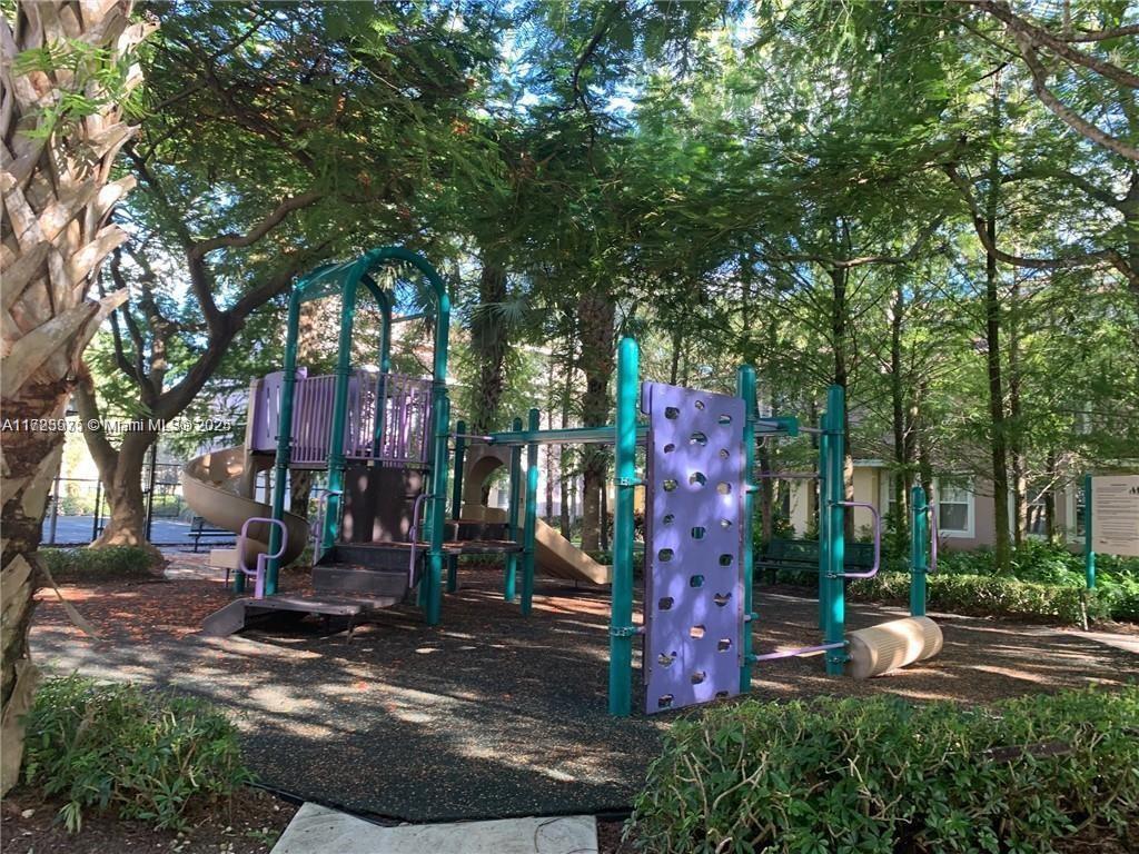 6776 West Sample Road, Unit 6776 Coral Springs, FL 33067 - Photo 19 of 20 a view of outdoor space yard and tree s