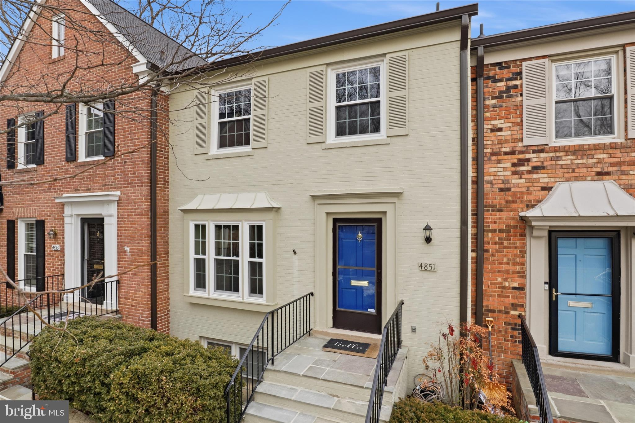 4851 Sangamore Road, Unit 25 Bethesda, MD 20816 - Photo 1 of 41 a front view of a house with a yard